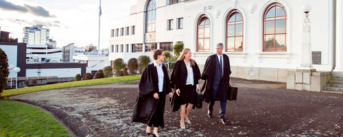 Harkness Henry Lawyers walking into Hamilton District Court House