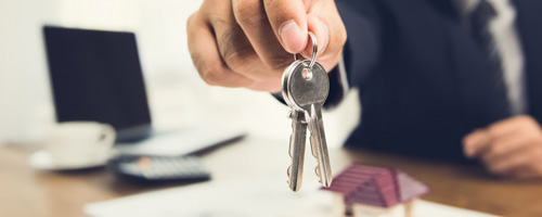 Man handing over keys