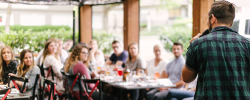 Group of people listening to a speech